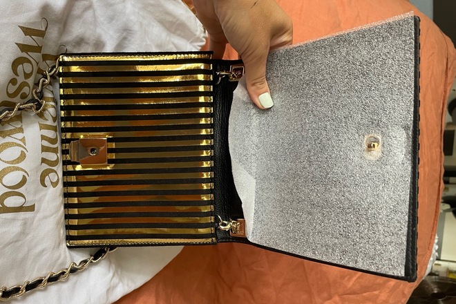 Gold vivienne westwood discount clutch