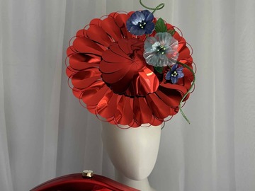 For Rent: Metallic red blooming disc with yellow swirl and blue flower